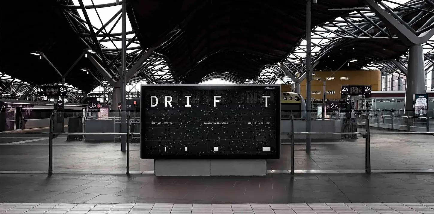 DRIFT festival screen at a train station