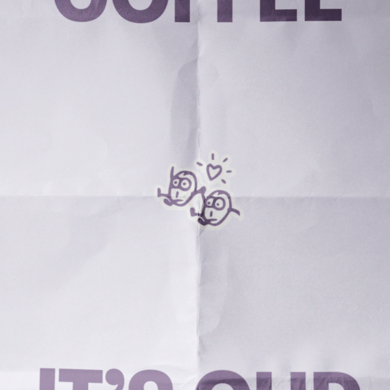Poster Design for Commonfolk: a close up of a folded poster with two coffee bean characters
