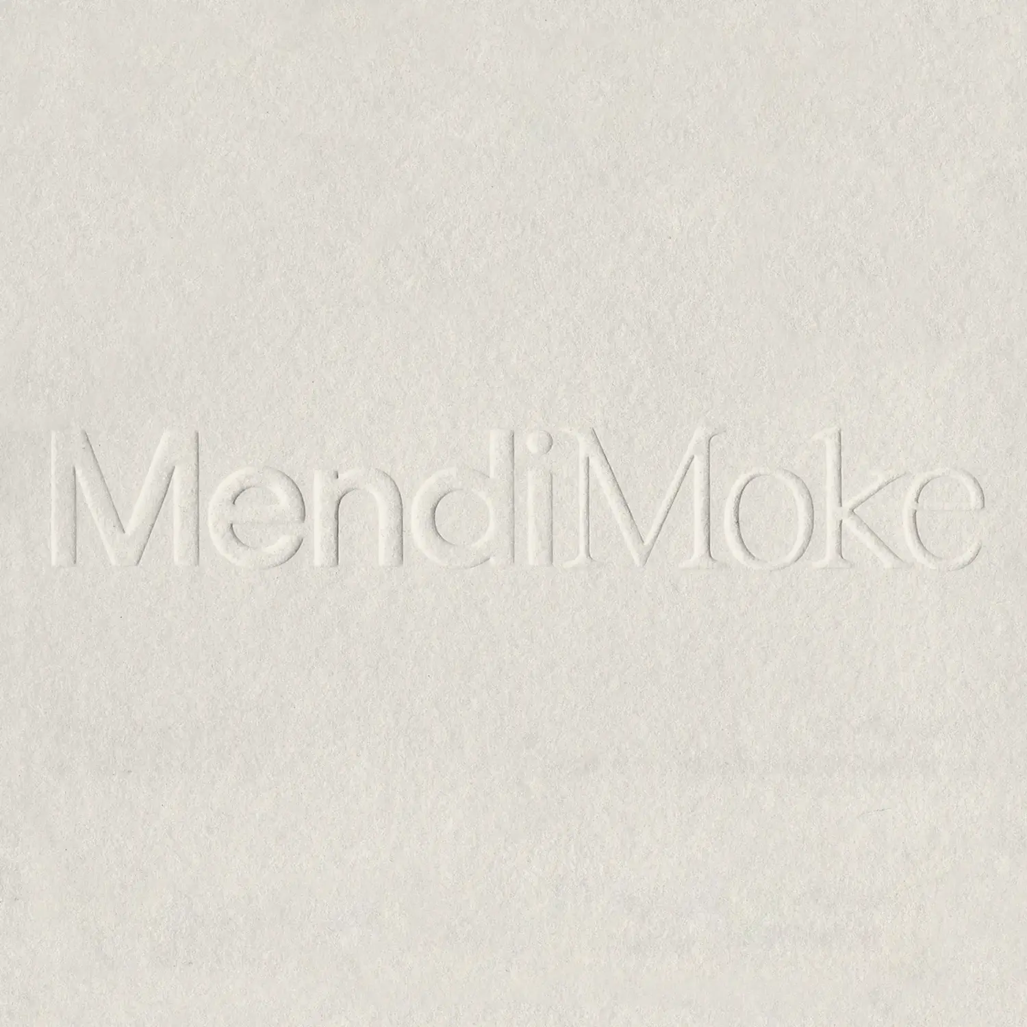 Mendi Moke wordmark embossed on white paper