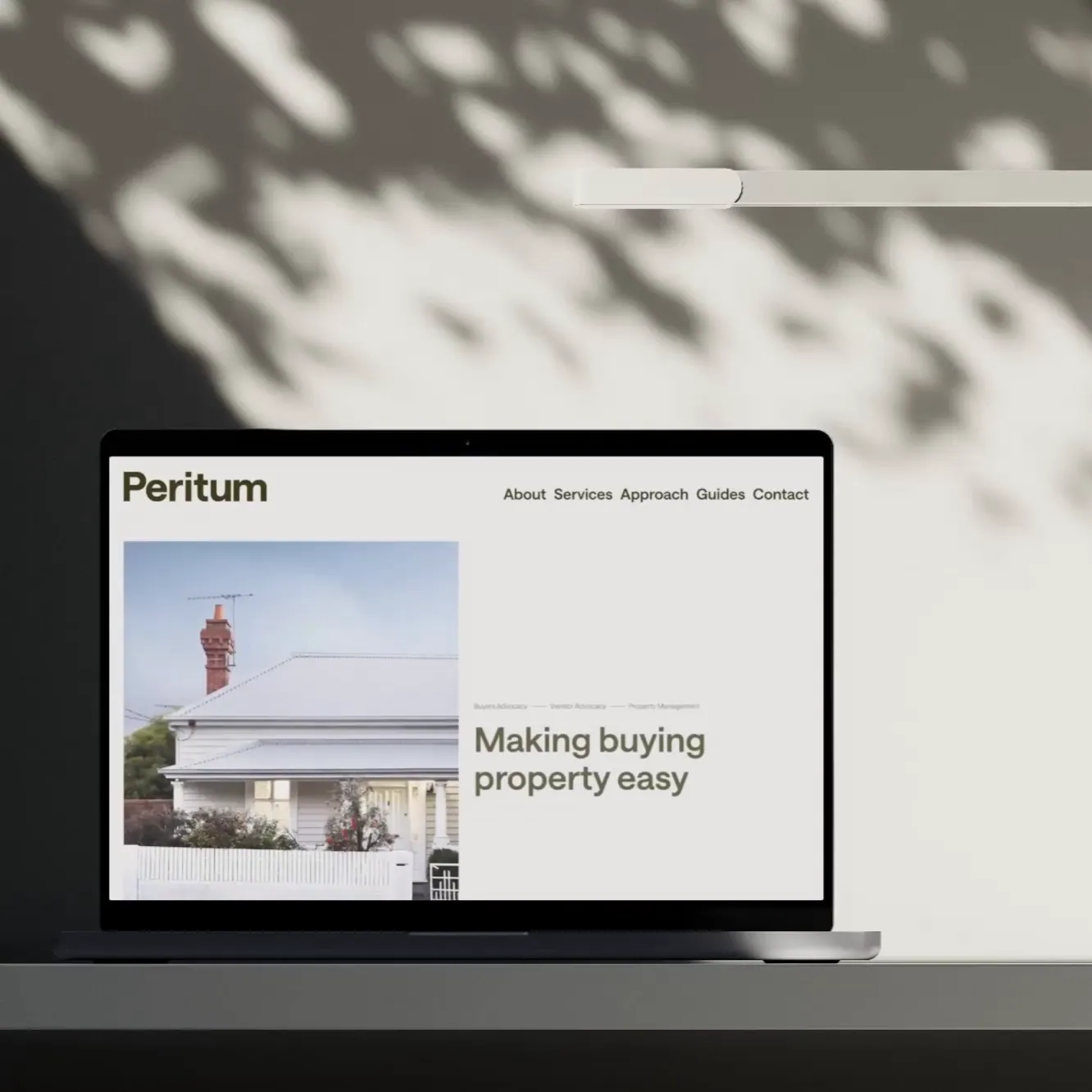 Branding Design for Peritum Website on a laptop