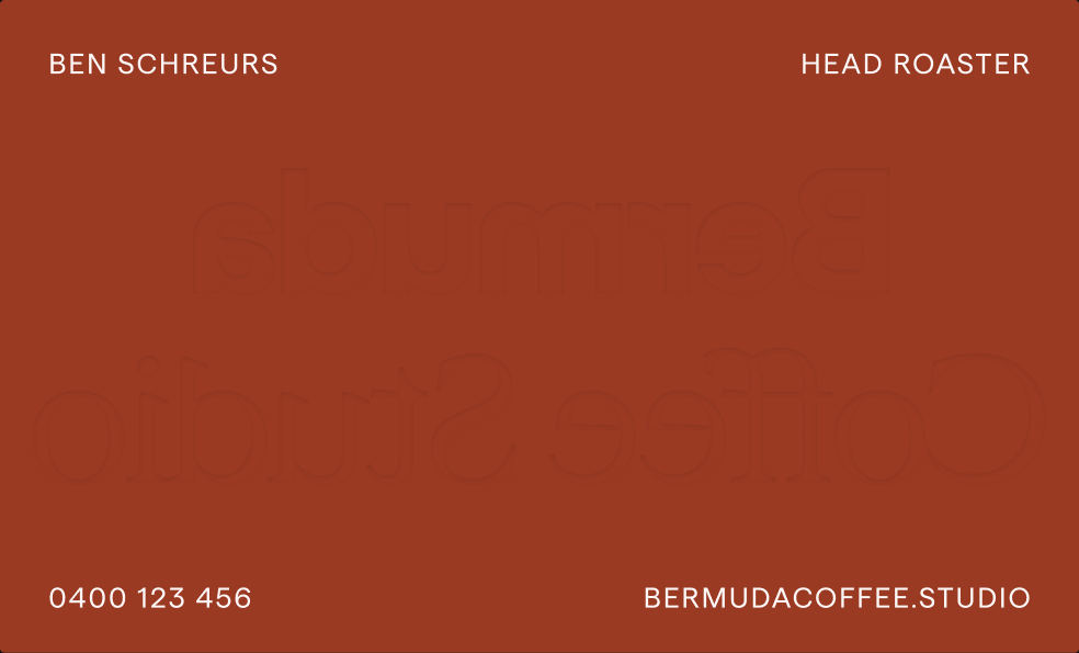 Business Card Design for Bermuda Coffee Studio, the back in Deep Terracotta with Ben Schreurs' details and the wordmark's reverse impression